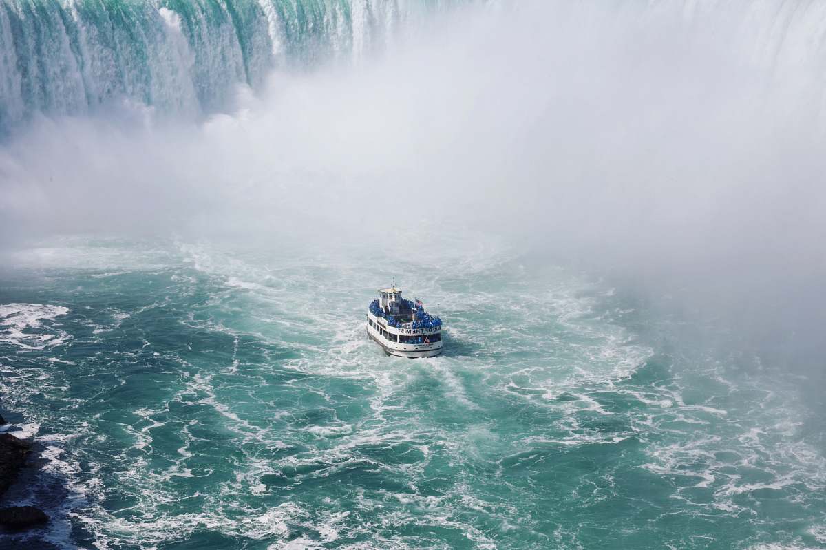 niagara falls ship on body of water near falls waterfall